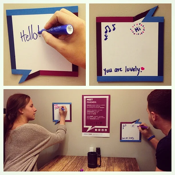 People using the Josh + Gab interactive posters. 