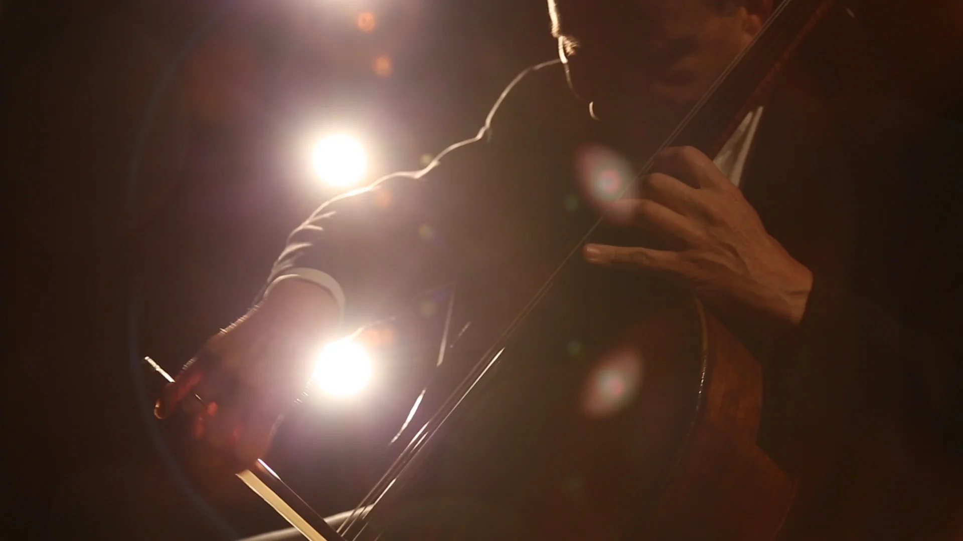 A still from the video interstitials, featuring cellist Udi Bar-David