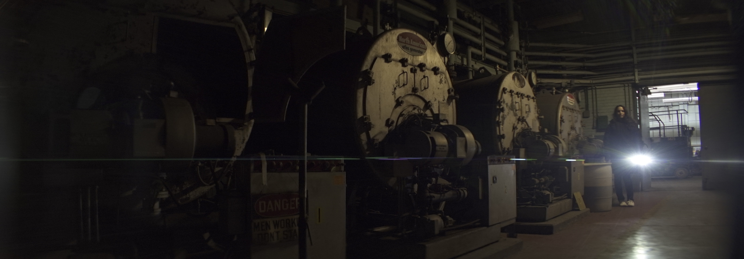 Elite 24.5mm anamorphic | Warehouse, Cleveland, OH - Lens flare triggered by Olivia Otten with the Nitecore P12 flashlight. Image captured wide open at T2.1. Image displayed full gate, 3.00:1. Photo by Keith Nickoson.