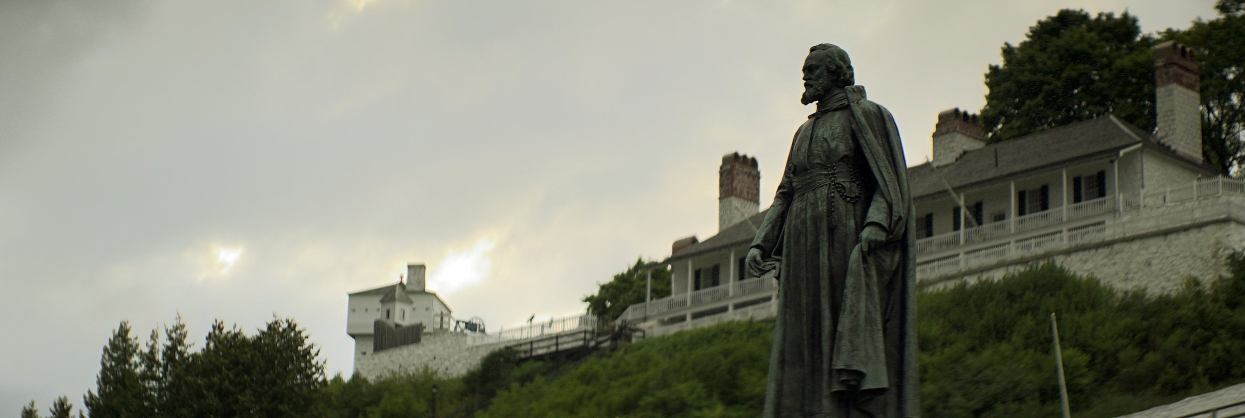 Lomo 100mm anamorphic lens | Statue of Father Marquette in Marquette Park - Mackinac Island, MI - Photo by: Keith Nickoson