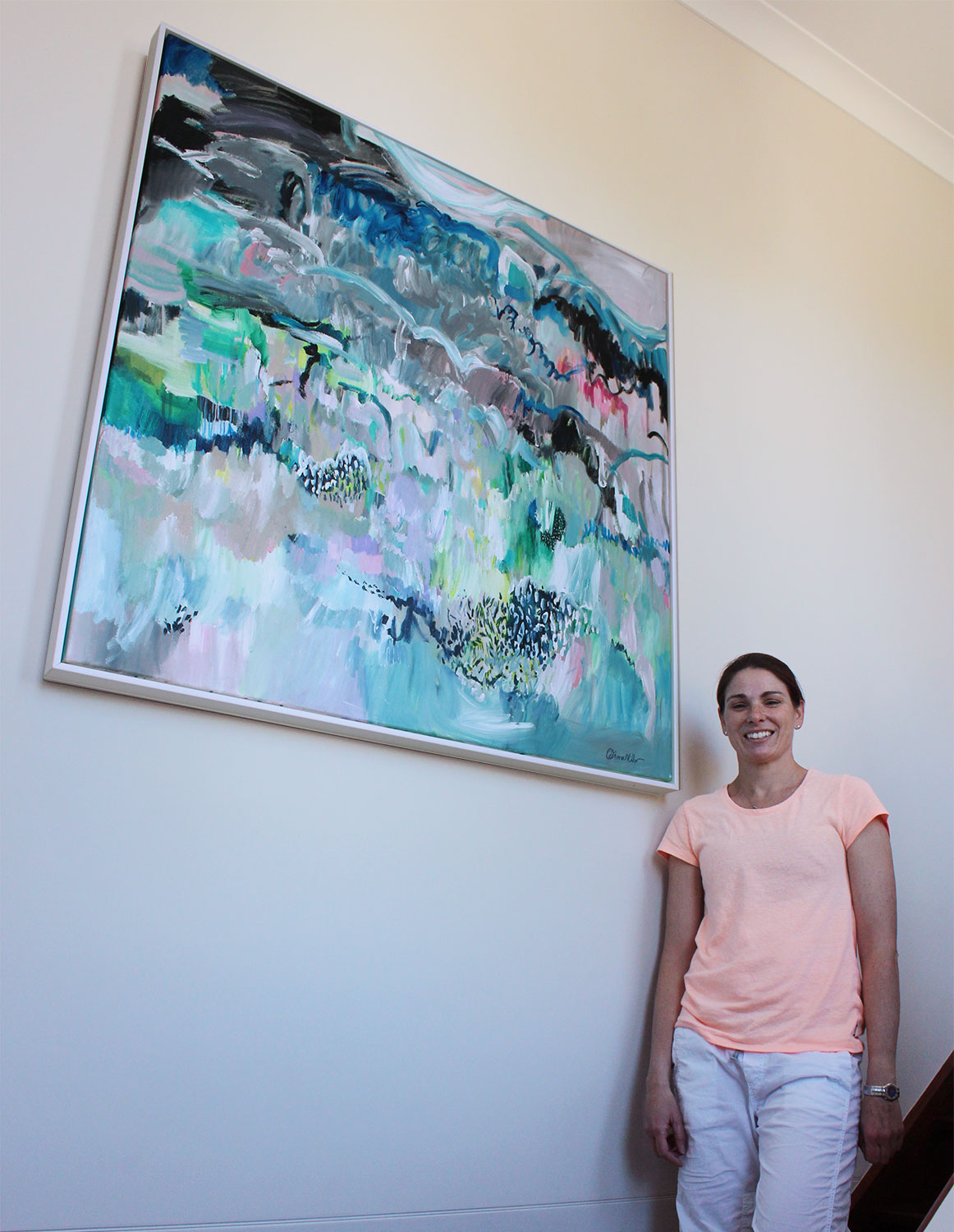 Tahnee with her painting "Moments in Spontaneum"