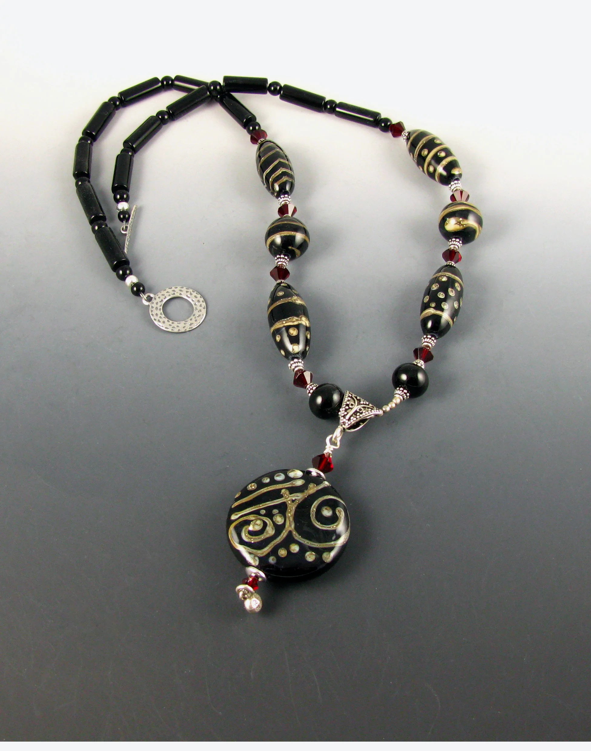 Silver stringer on black necklace.jpg