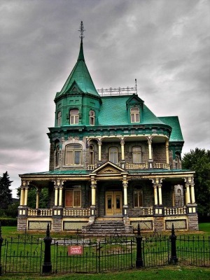 Located in Quebec has a distinctive copper roof that has weathered over time.