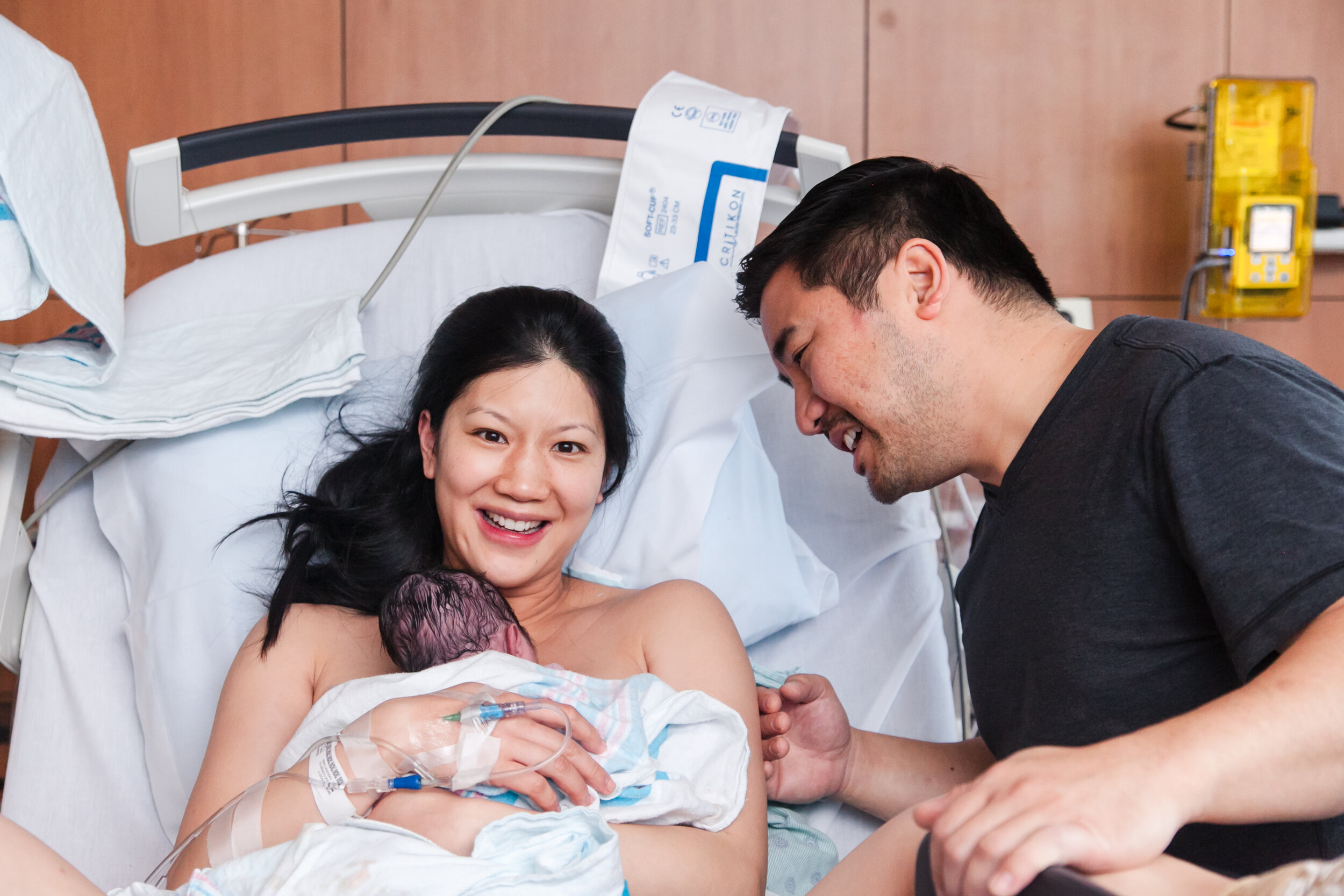 smiling-mother-after-birth-prentice-hospital-birth-photography-chicago.jpg