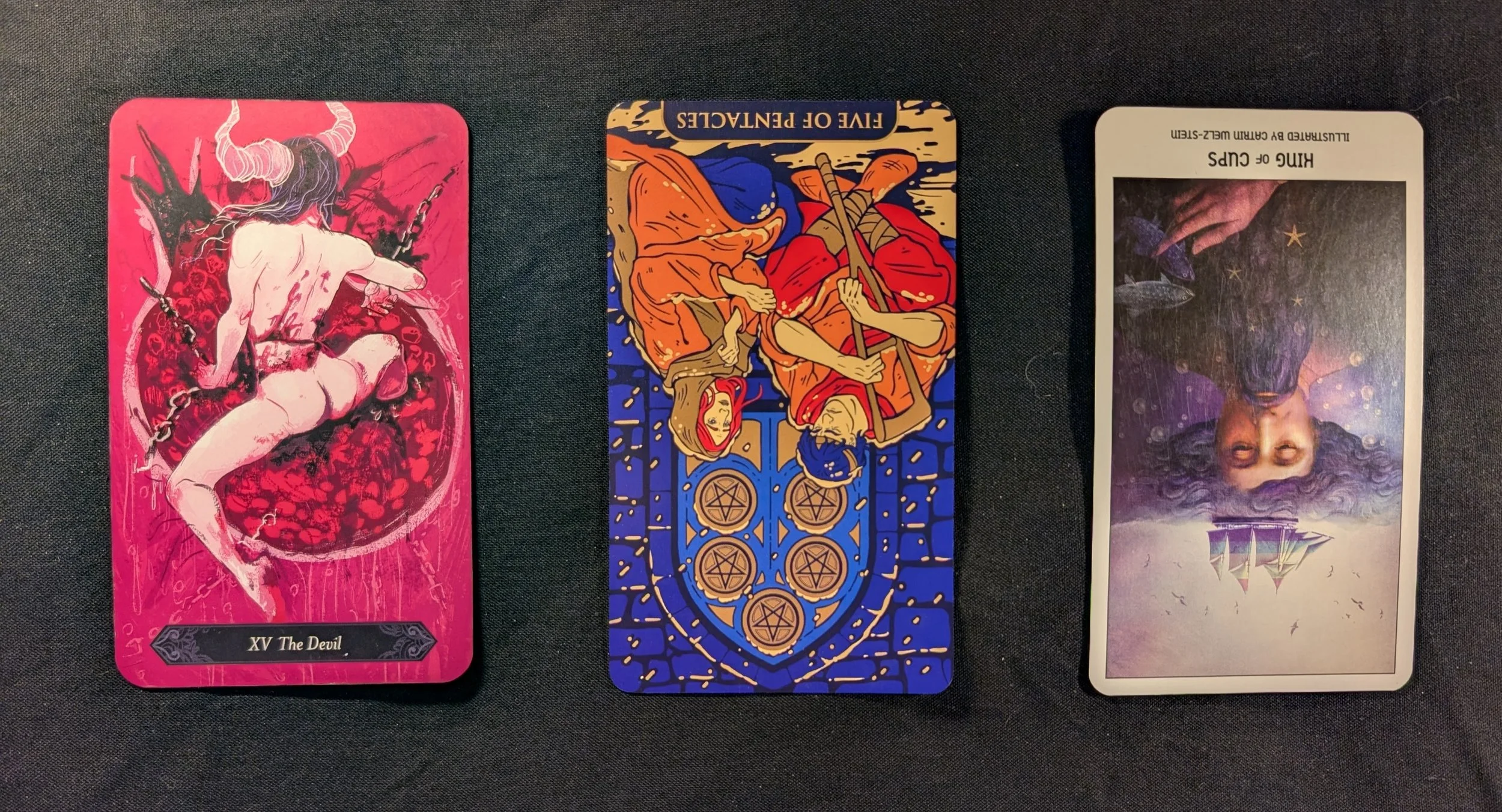The Devil, Five of Pentacles, and King of Cups