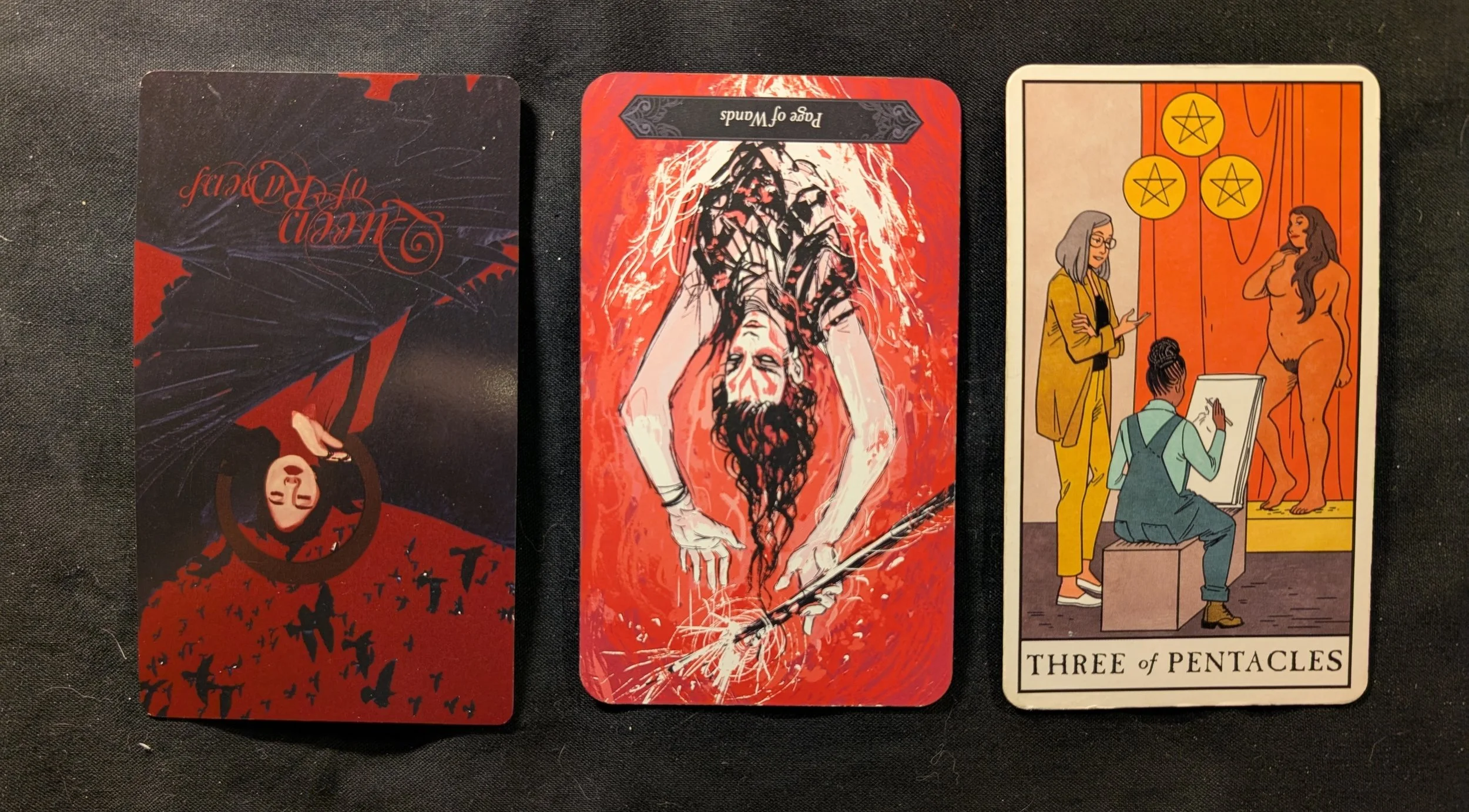 Queen of Ravens, Page of Wands, Three of Pentacles