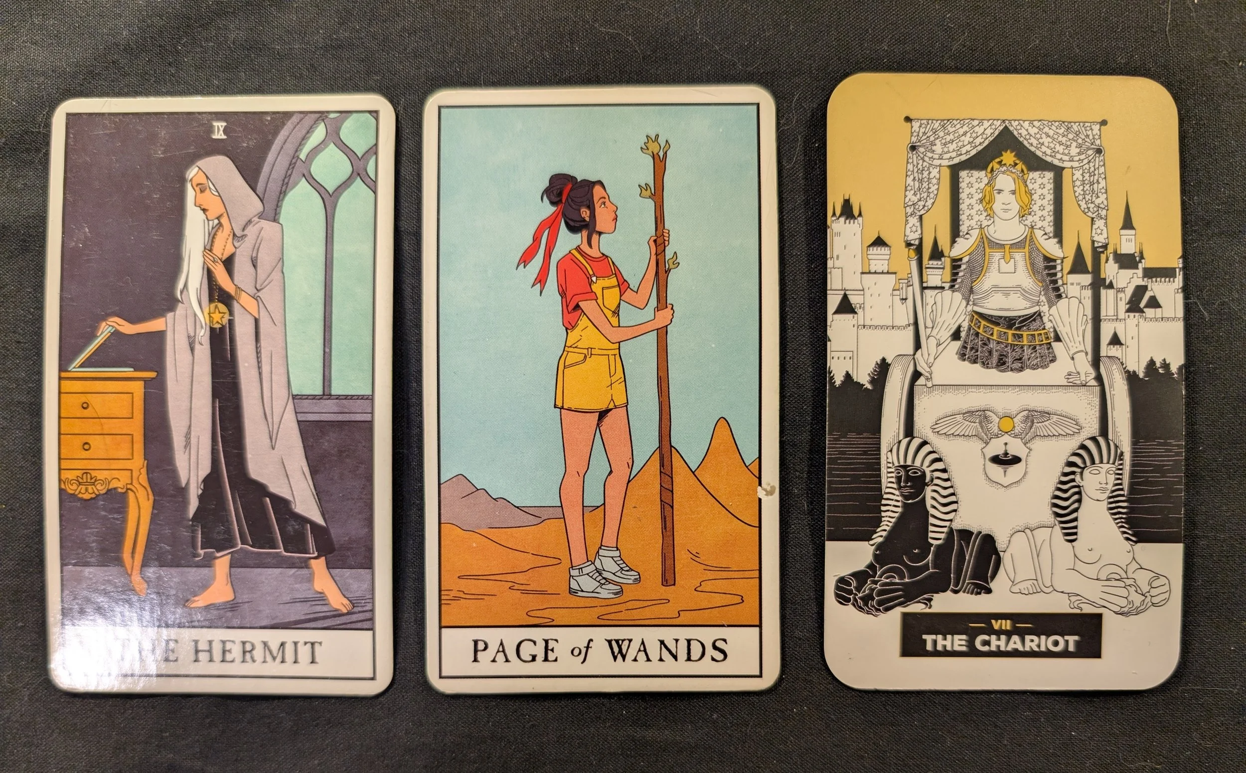 The Hermit, Page of Wands, and the Chariot