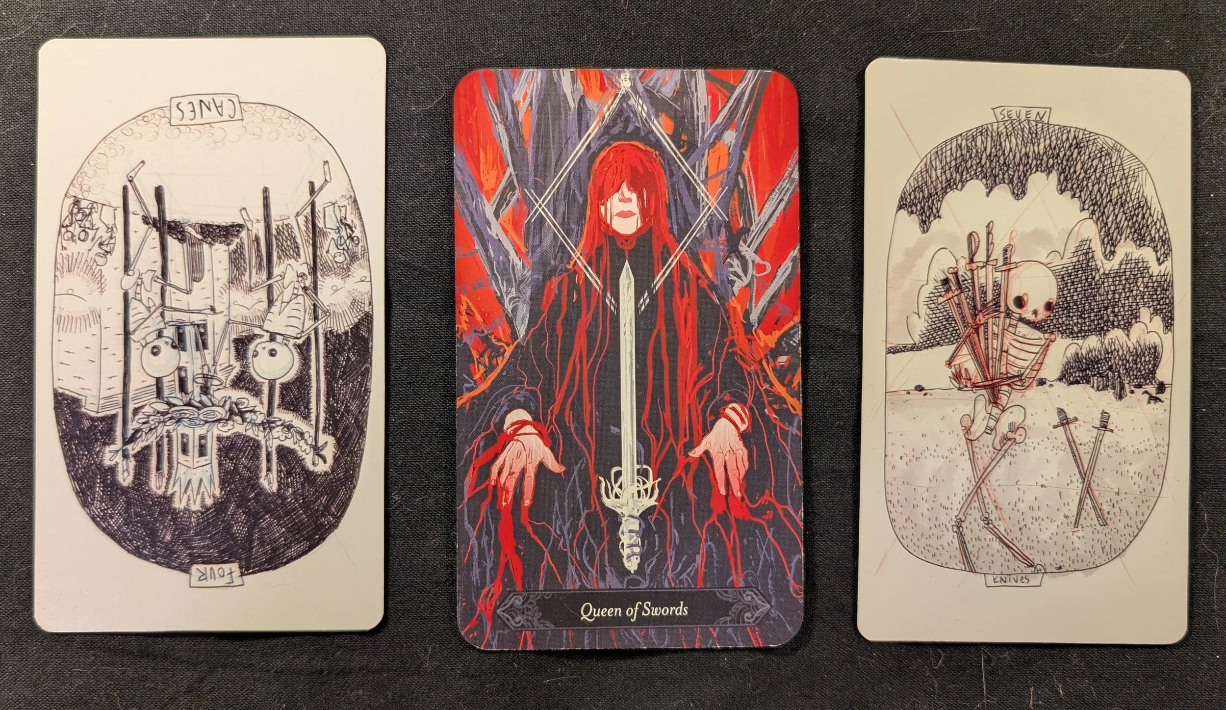 Four of Wands, Queen of Swords, and the Seven of Swords
