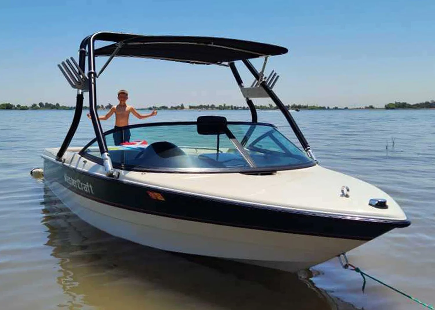 Wakeboard tower bimini mounted up high for more head room.