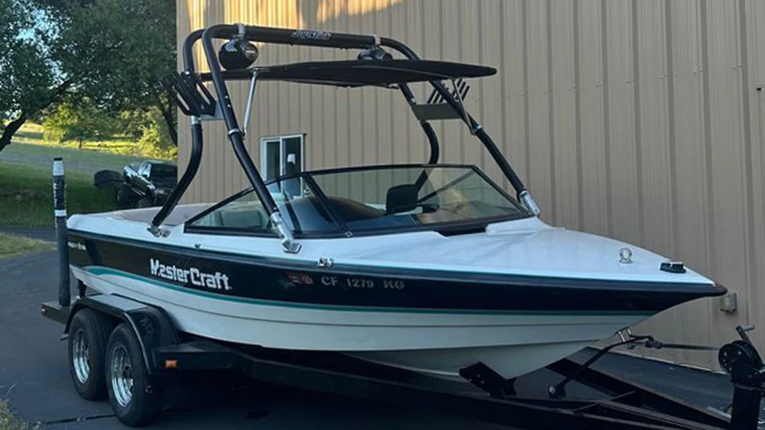 Wakeboard tower bimini mounted under speakers.