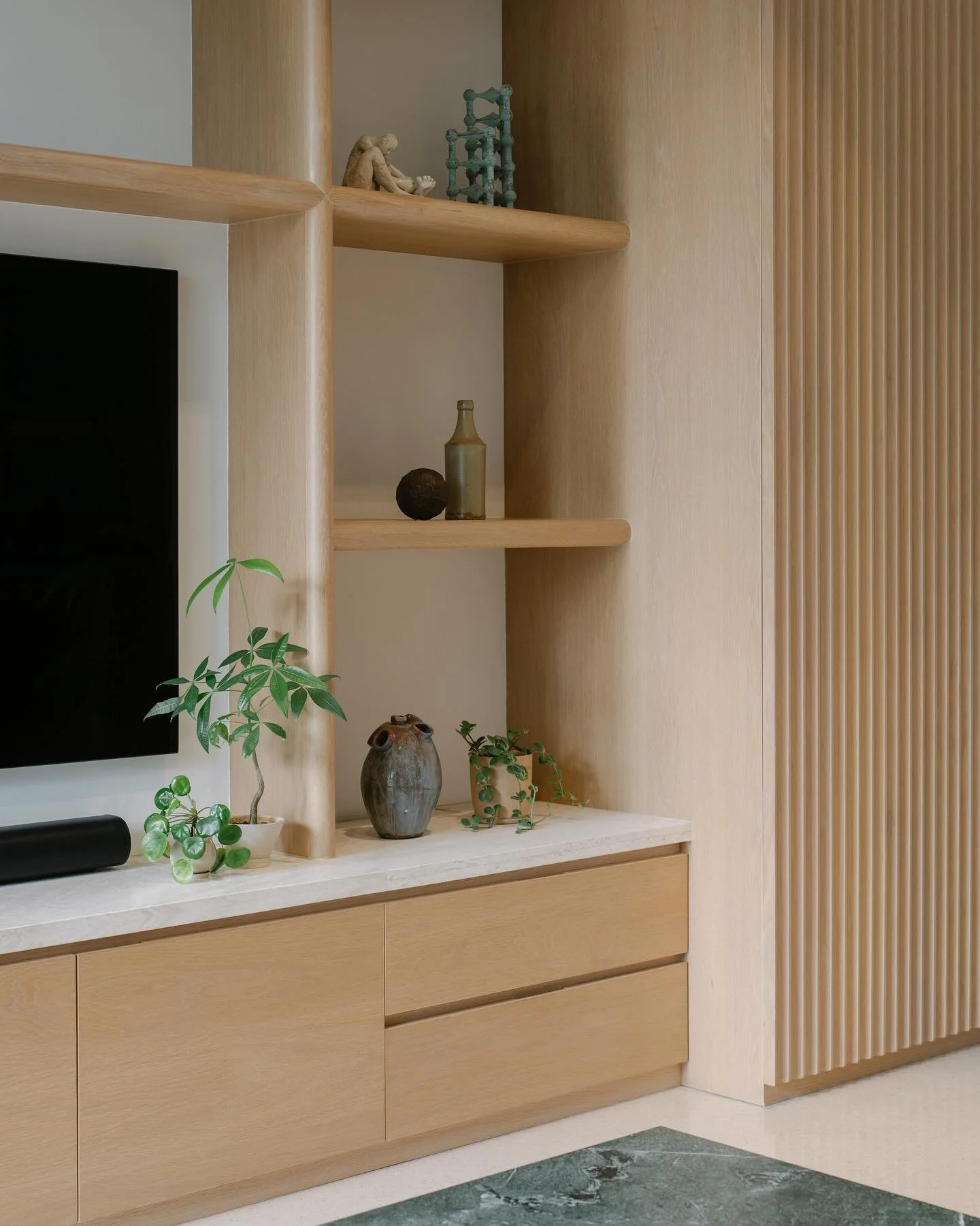 Balmoral Apartment 

Living room with display shelving and storage in oak and ivory travertine.
Vintage lounge chairs from @noden__ 

#takenouchiwebb 
#singaporedesign 
#sginteriordesign 
#sginterior 

Photography: @khoogj_