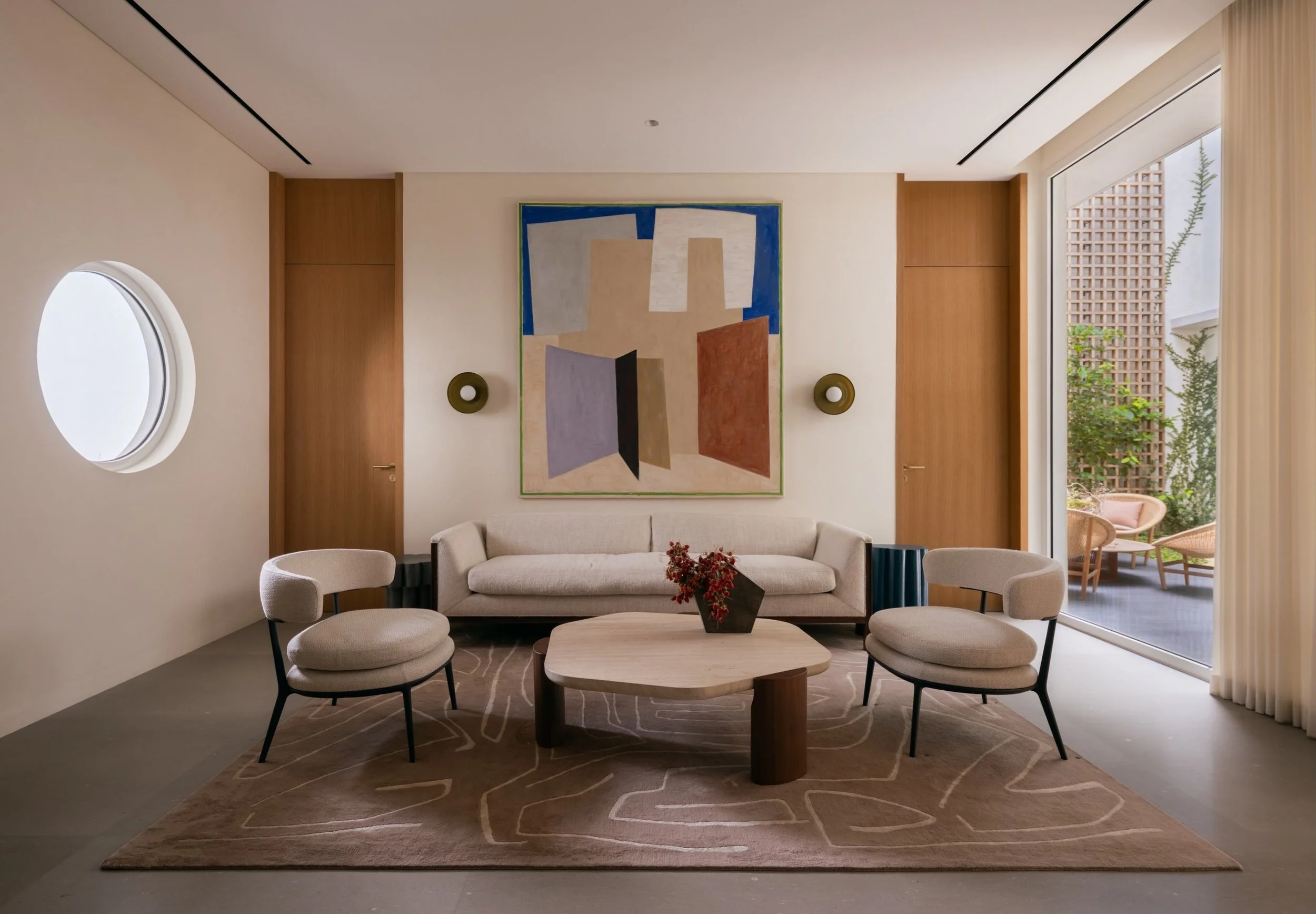 Jakarta Courtyard House

The first area on entering is the reception room, which can be separated off from the main space with a large single sliding door.
From here guests have views into the main courtyard with a powder-room behind the back wall.

