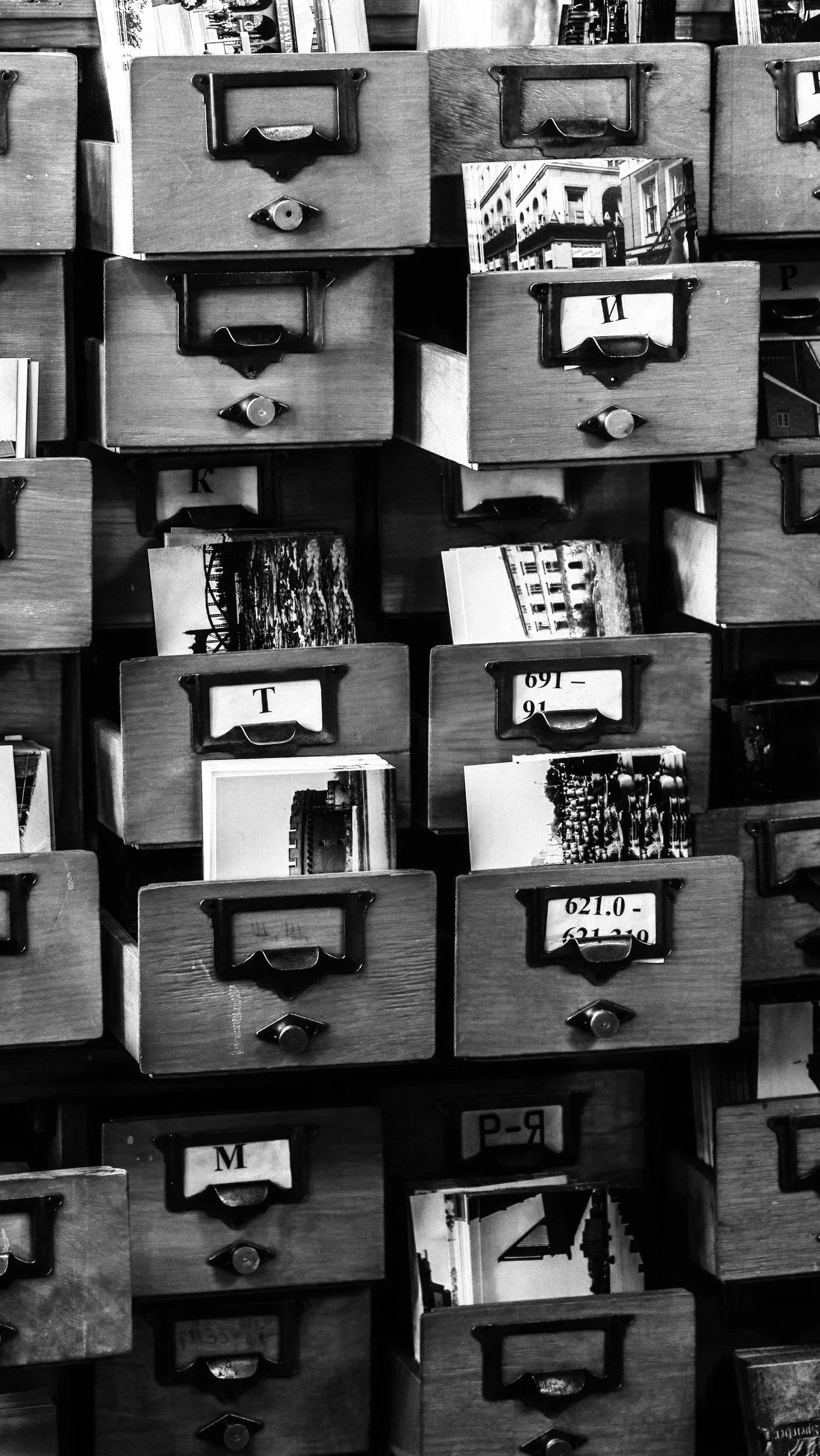 image of photography archive with photographs appearing from drawers