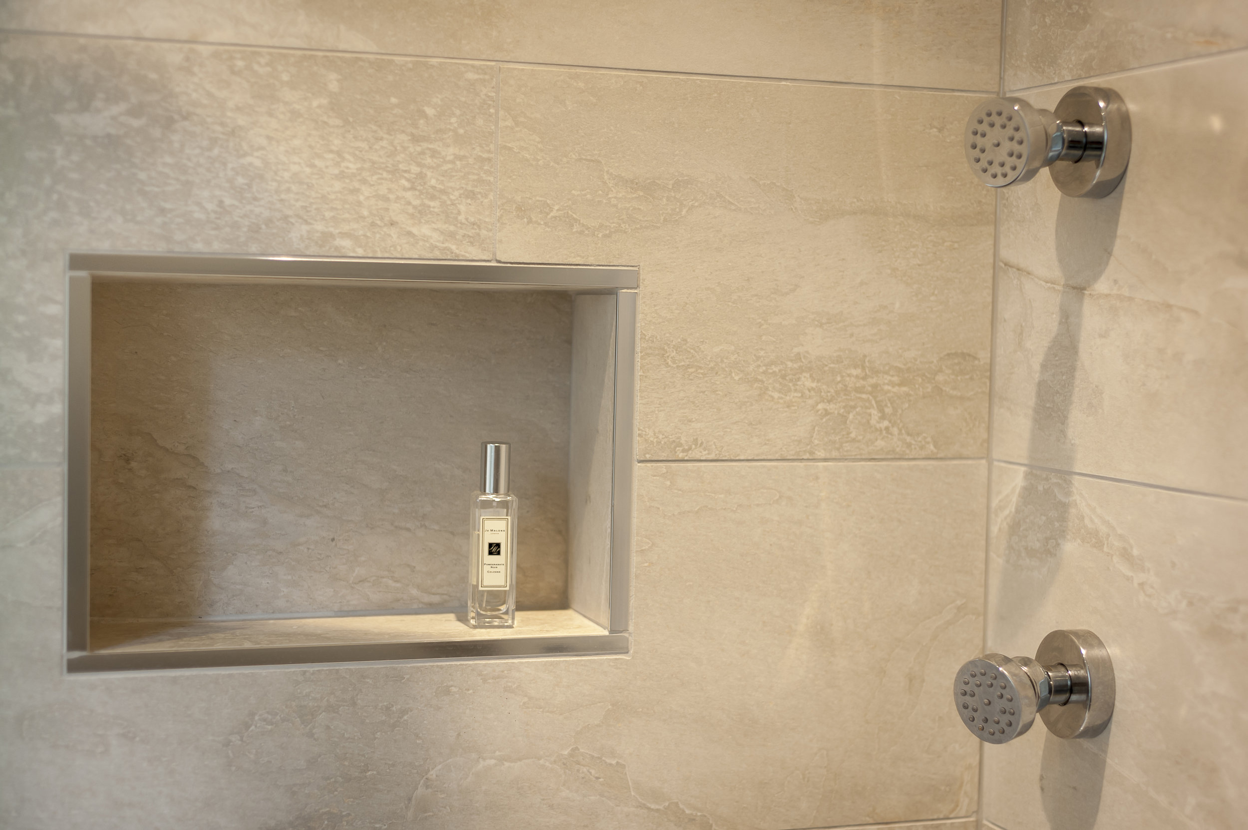 Walk-in Shower with Body Jets against Limestone Tiles