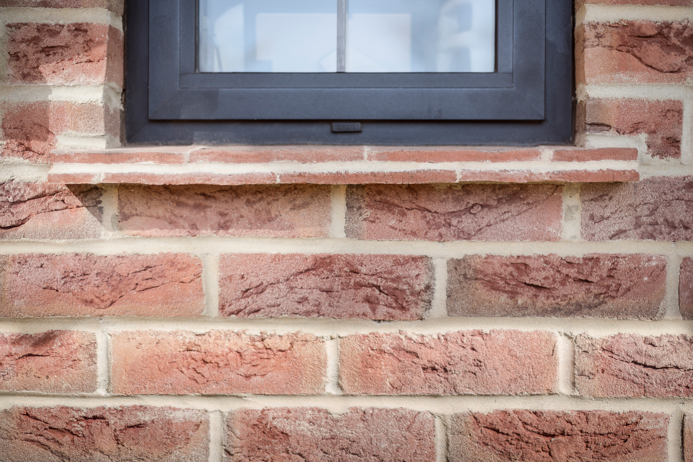 Leaded Light Window with Tiled Window Ledge and Brick Detail 