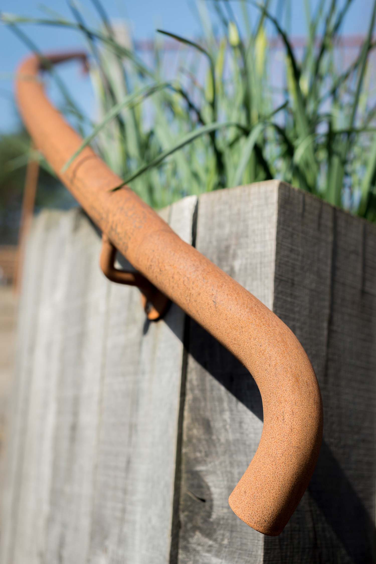 Weathered Oak Post Retaining Wall with Rusted Steel Hand Rail 