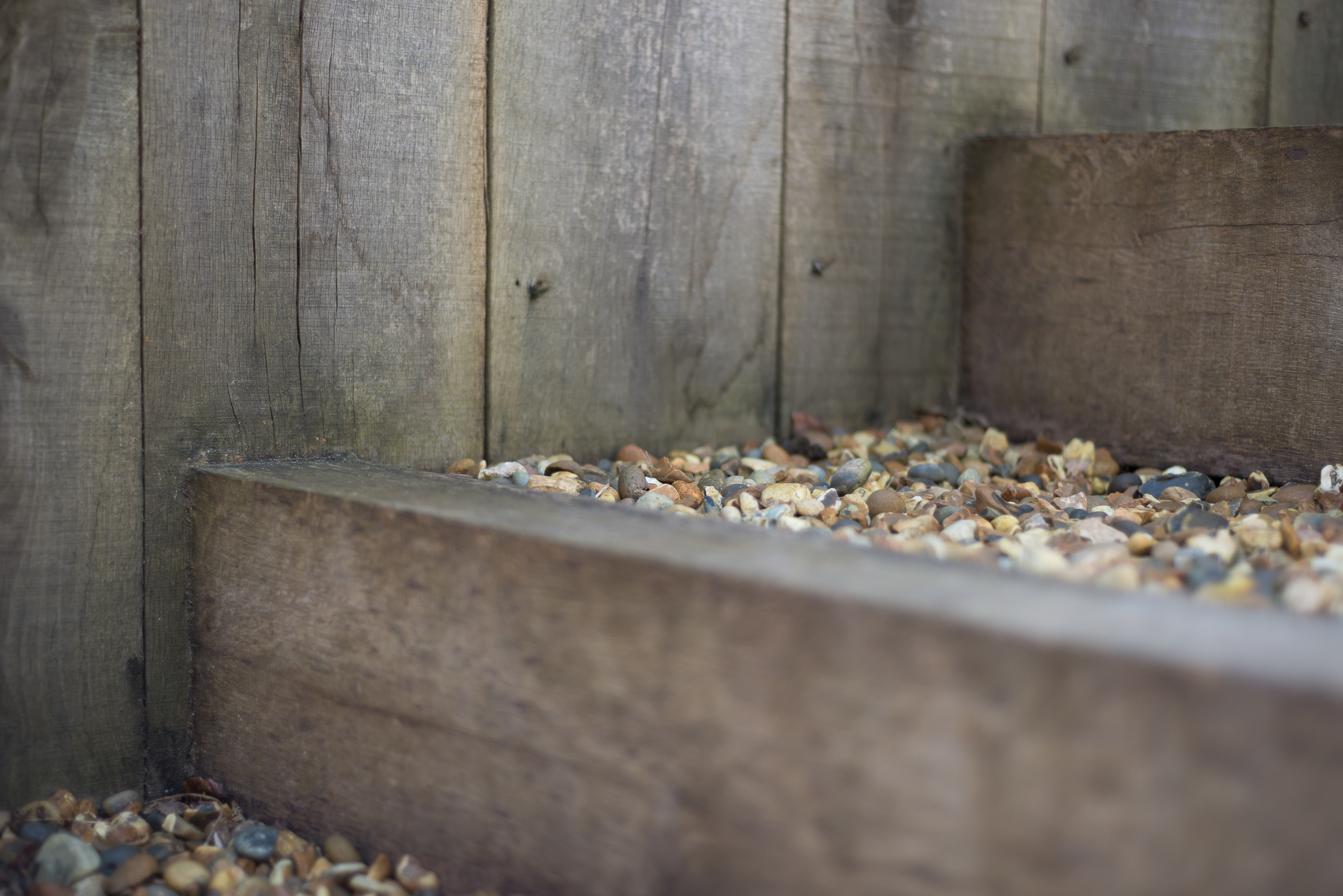 Detail of Weathered Oak Post Retaining Wall and Risers with Shingle Treads
