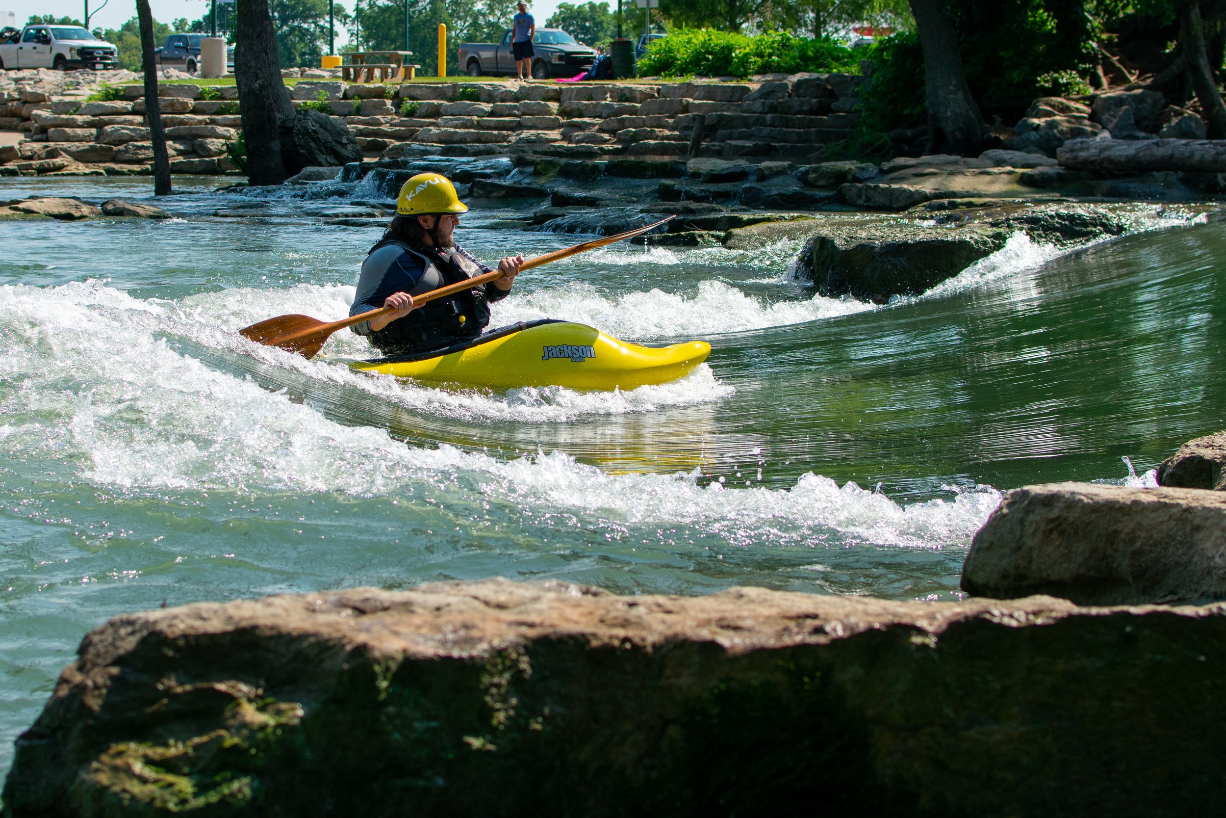 man kayaking in front of swimming hole rocks kayak park 2021 2 (purchased).jpg