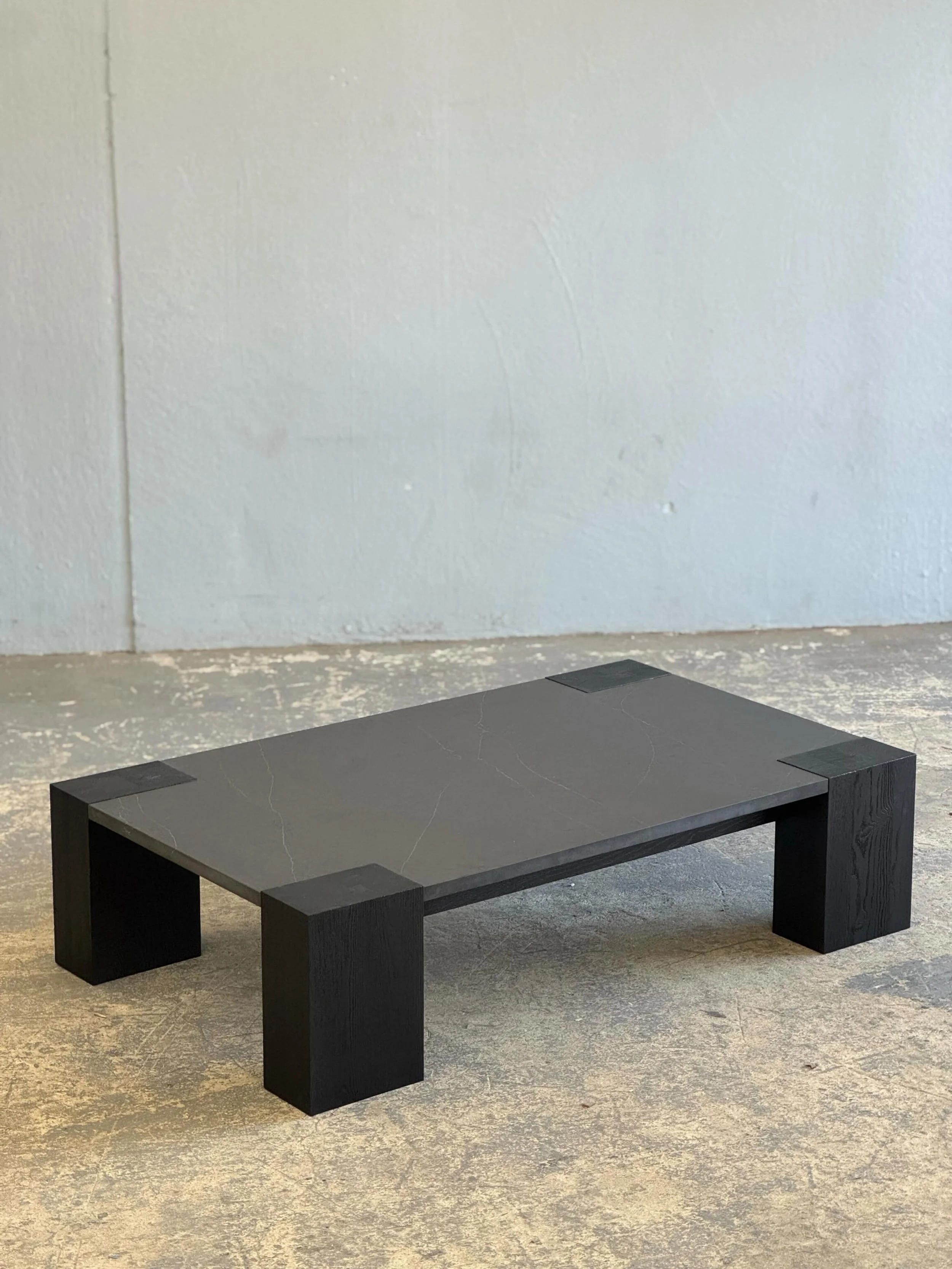 Blackened Ash and stone coffee table for @nilesbolton_assoc @temposavannah