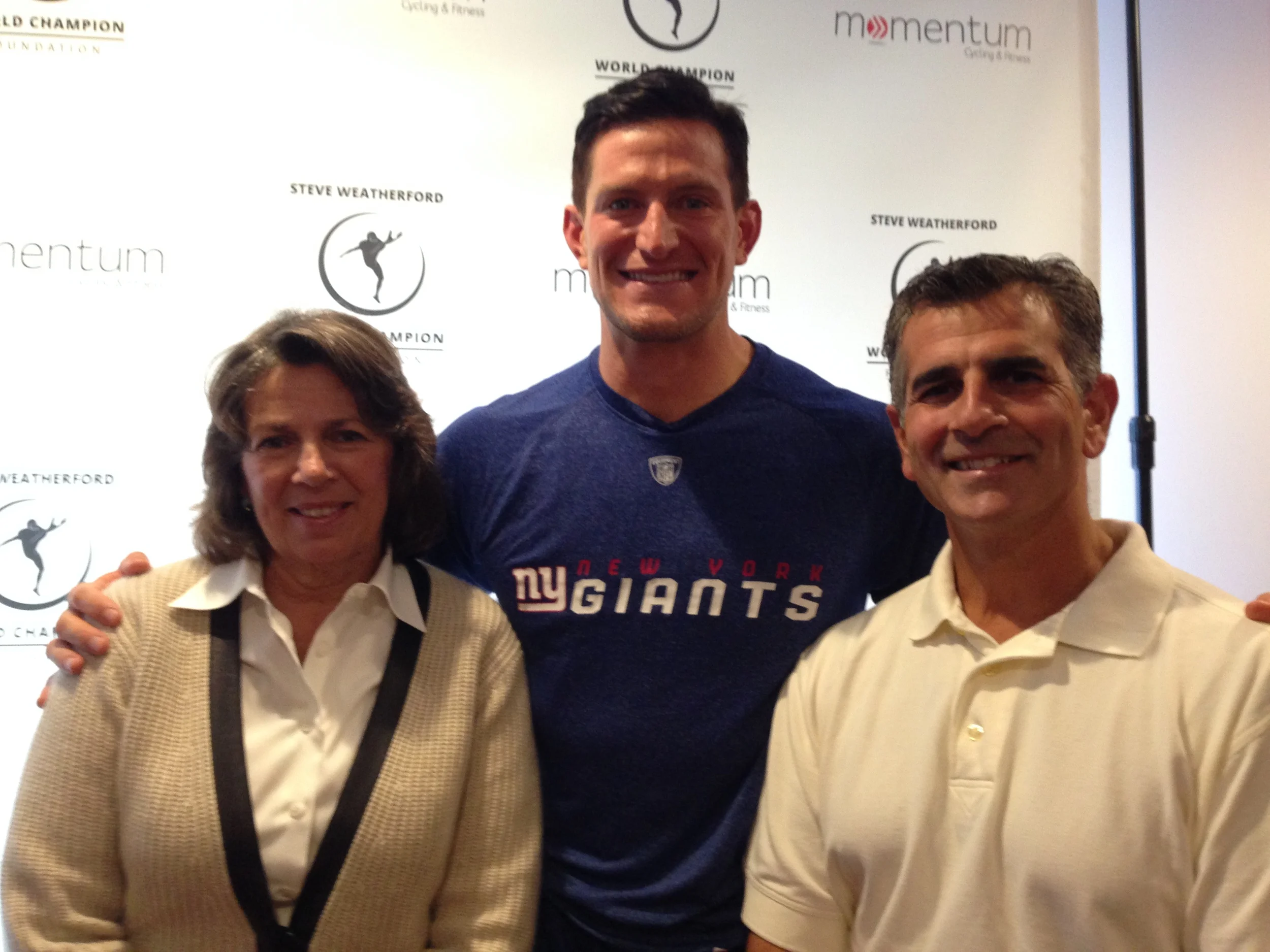 Dr. Rubino and Ellen Dickson at the ribbon cutting ceremony for Momentum Cycling & Fitness on Saturday, September 13th. NY Giants punter Steve Weatherford was there for the festivities. 
