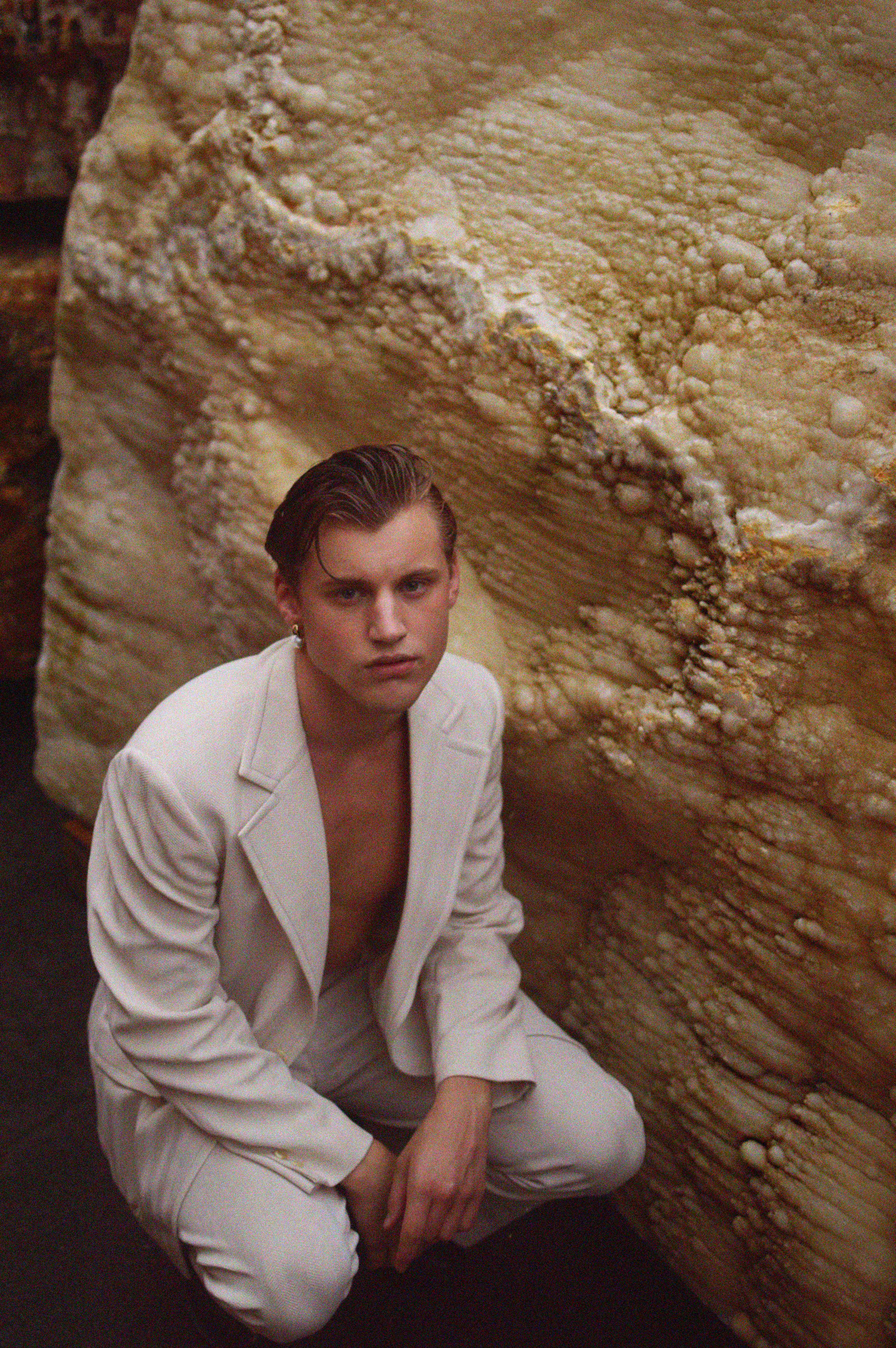 Quinton wears Luiny drop pearl earring and vintage suiting both available at The Break IRL .