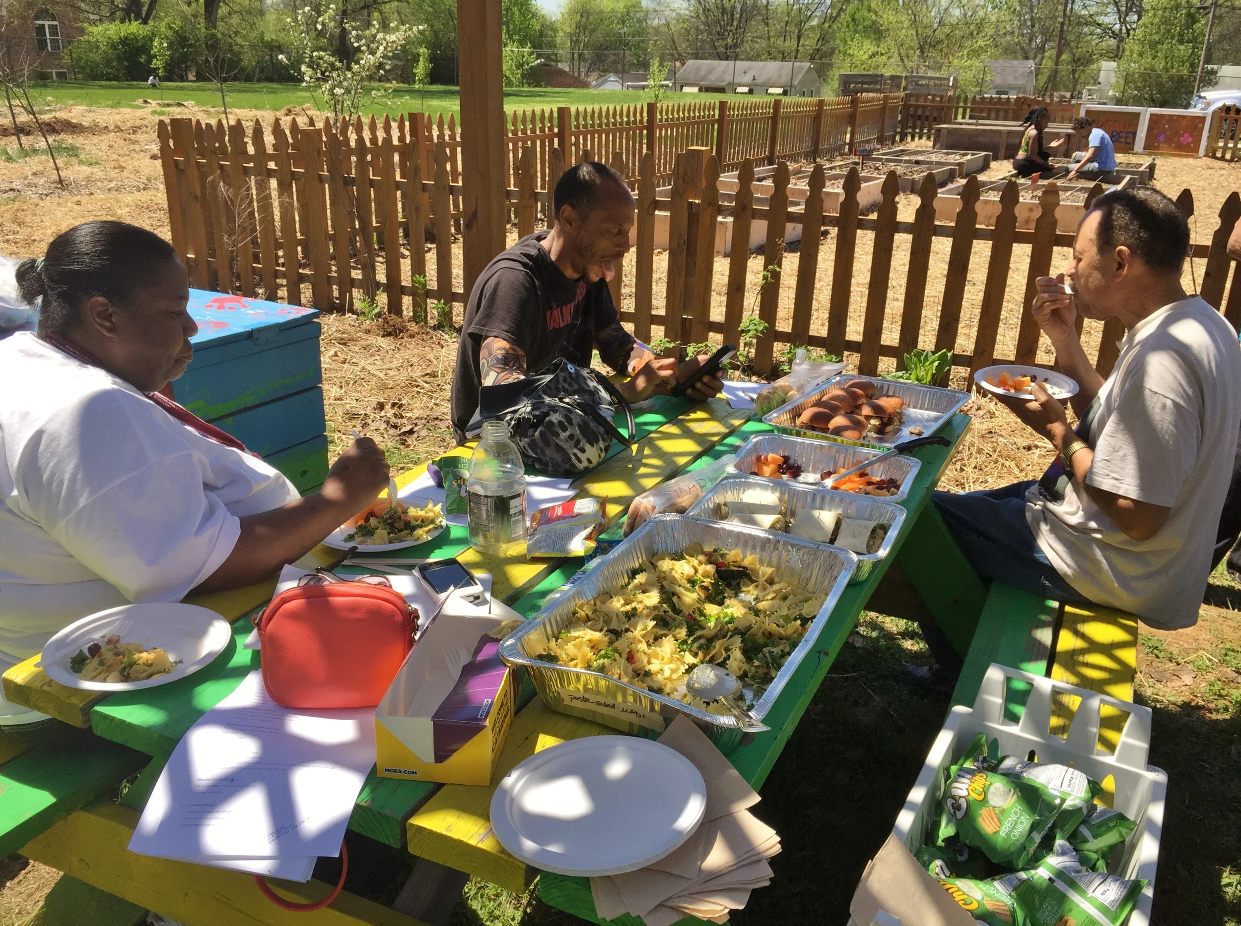 After planting spring crops and working together to get seed potatoes in the ground, the McGruder Green Thumbers gathered around picnic tables to relax and enjoy a delicious lunch.
