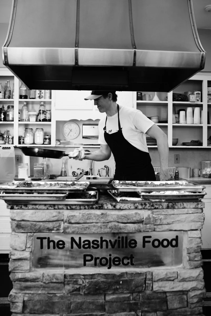 Chef Owen Clark of Rolf and Daughters working in The Nashville Food Project kitchens. Photo by Danielle Atkins.&nbsp;