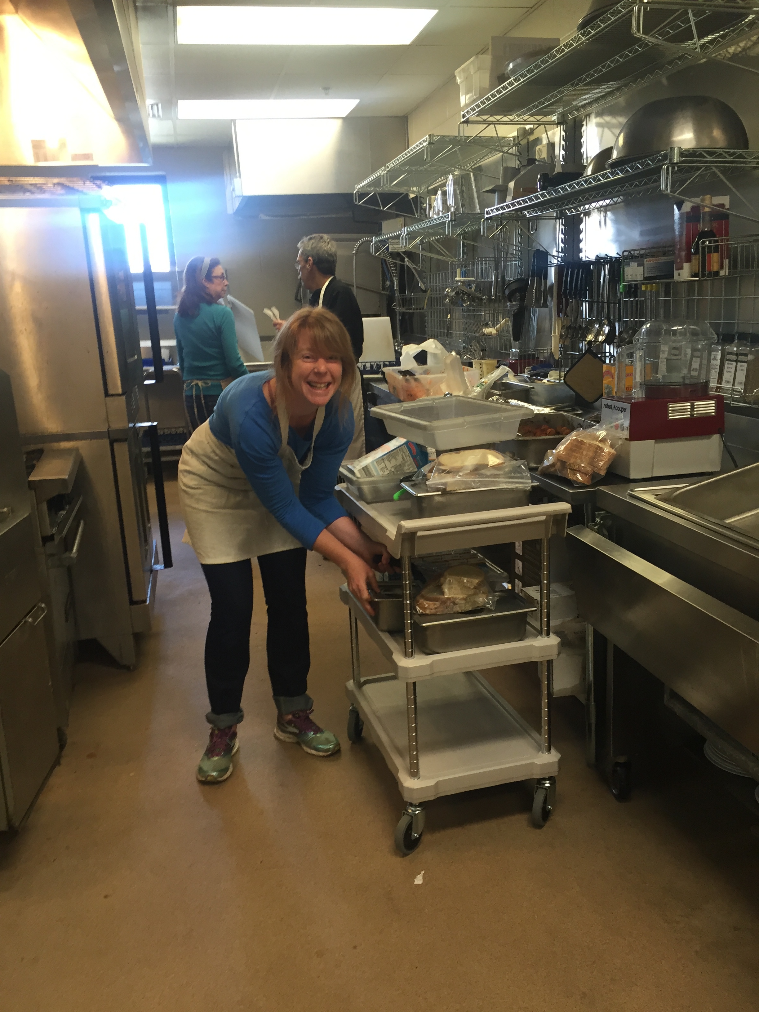 Here's Sarah loading up a cart to deliver meals to classrooms. 