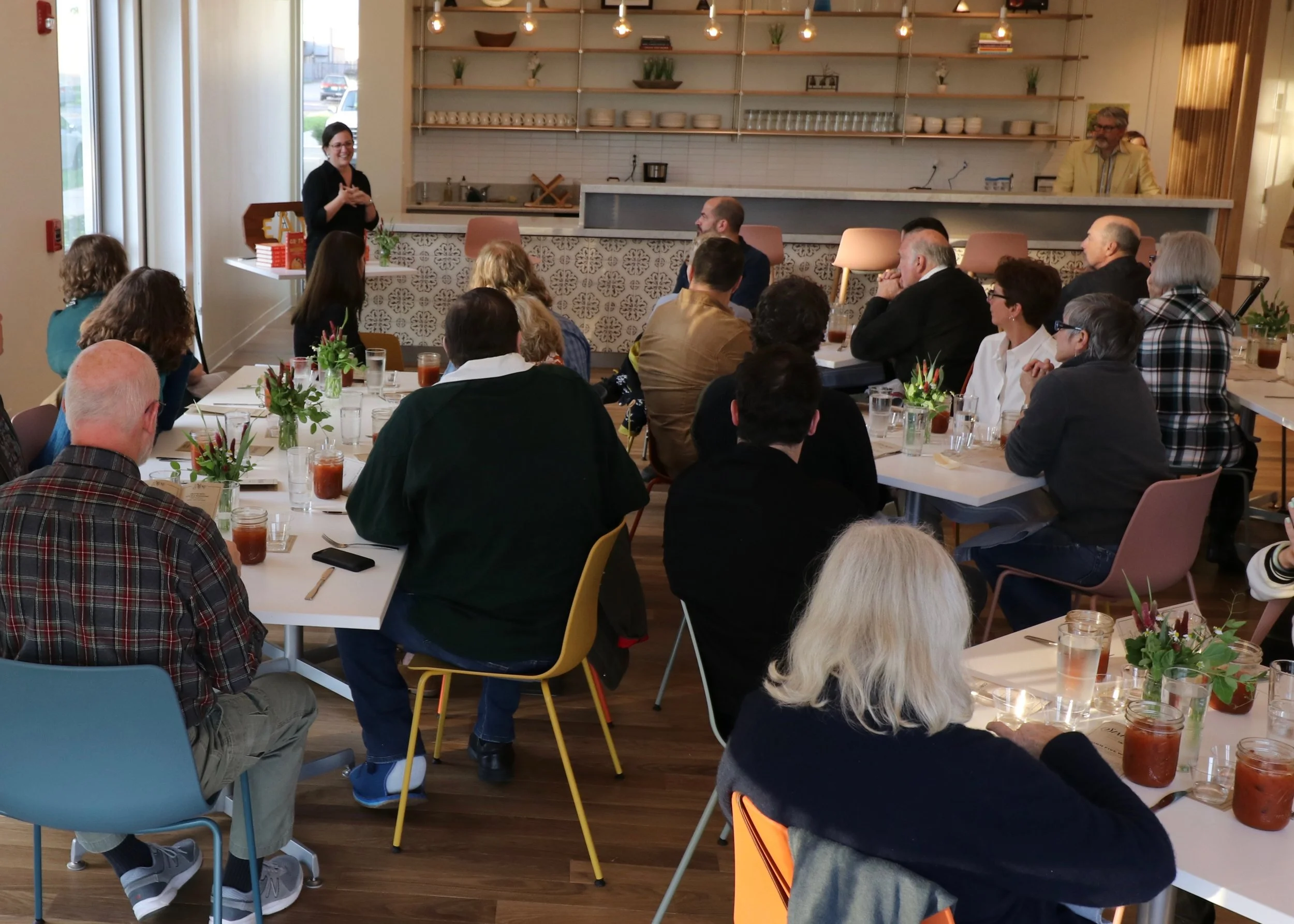 Author and journalist Erin Byers Murray welcomes guests.