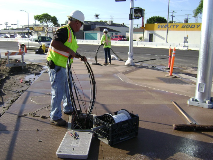 Pulling Traffic Signal Wire into conduits.jpg