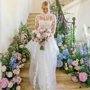First-Look-staircase-luxury-wedding-Chateau-de-Tourreau-Provence-South-of-France-colorful-flower-design-beautiful-bride.jpg