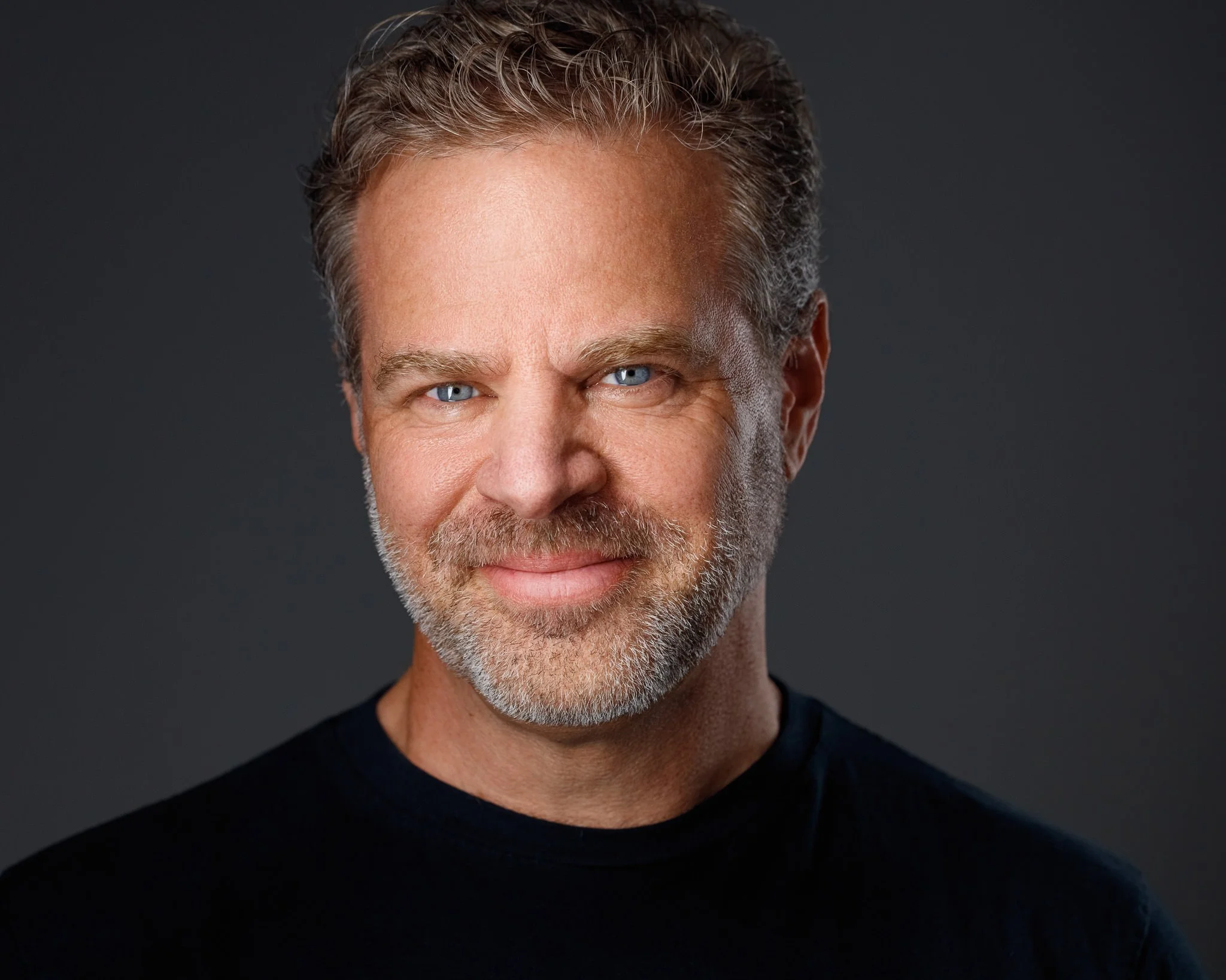 High-end professional headshot of man in Denver with confident expression and clean lighting