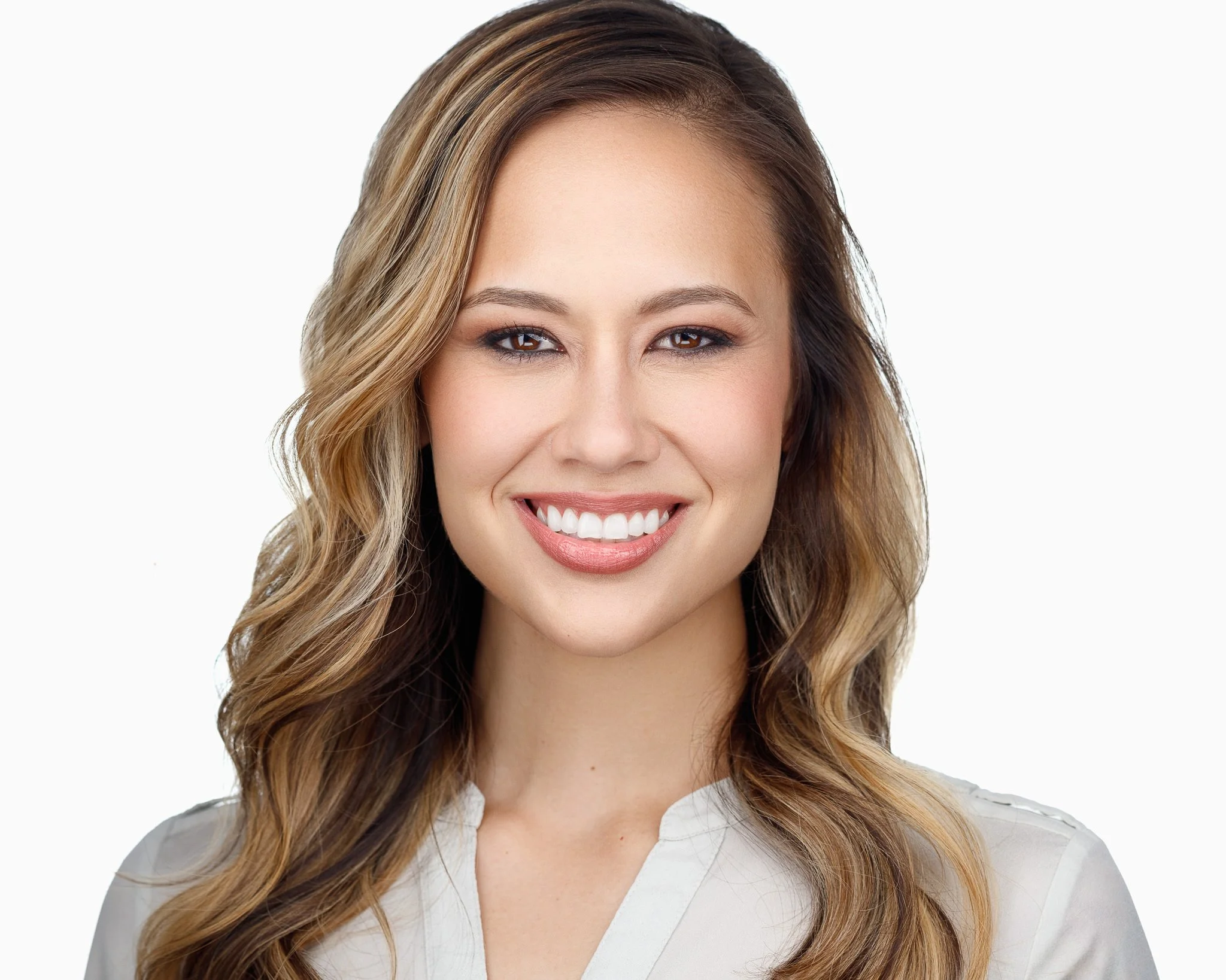 Bright professional headshot of woman in Denver with clean white background