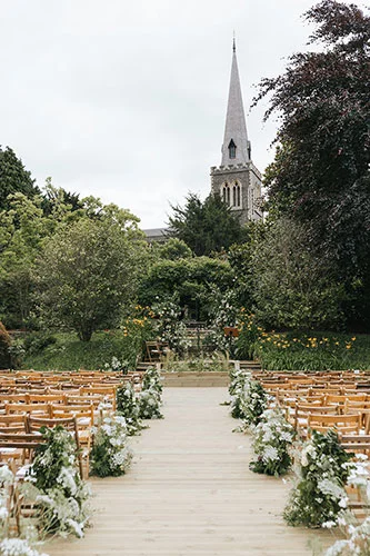 wild unique meadow lined aisle with ammi and garden roses at an elegant summer wedding in London