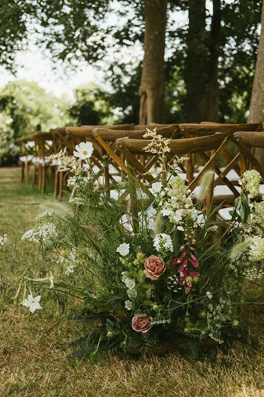 summer meadow style aisle for ceremony in Dorset