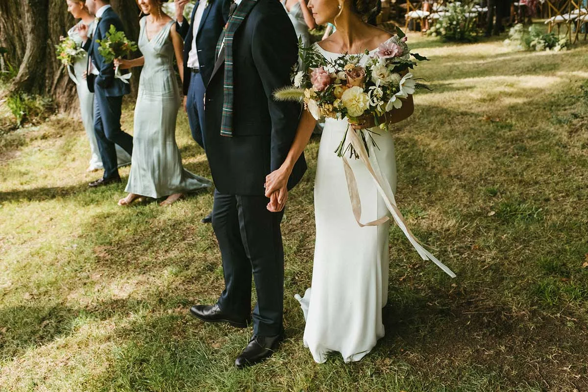 summer wedding bridal bouquet with unique wild flowers and silk ribbons for a Dorset wedding