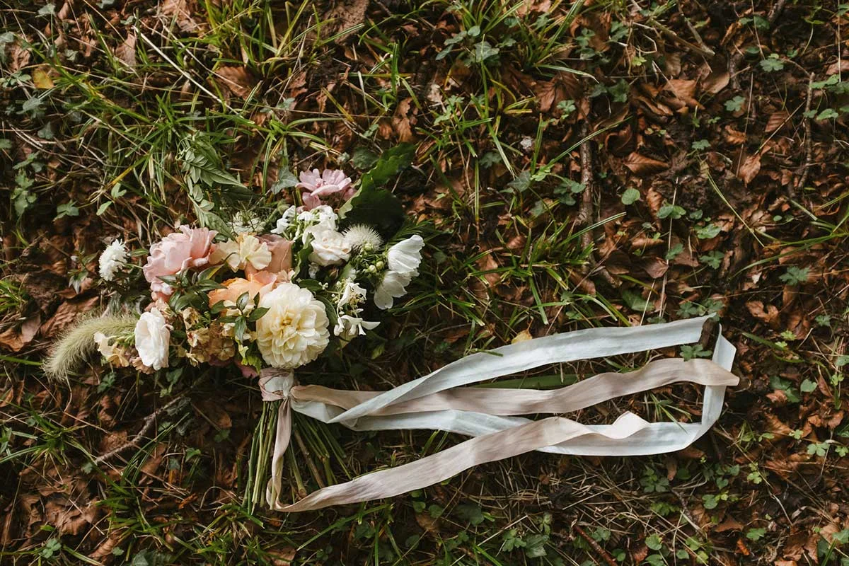 unique unusual bridal bouquet for a summer wedding in dorset with wild flowers and silk ribbons