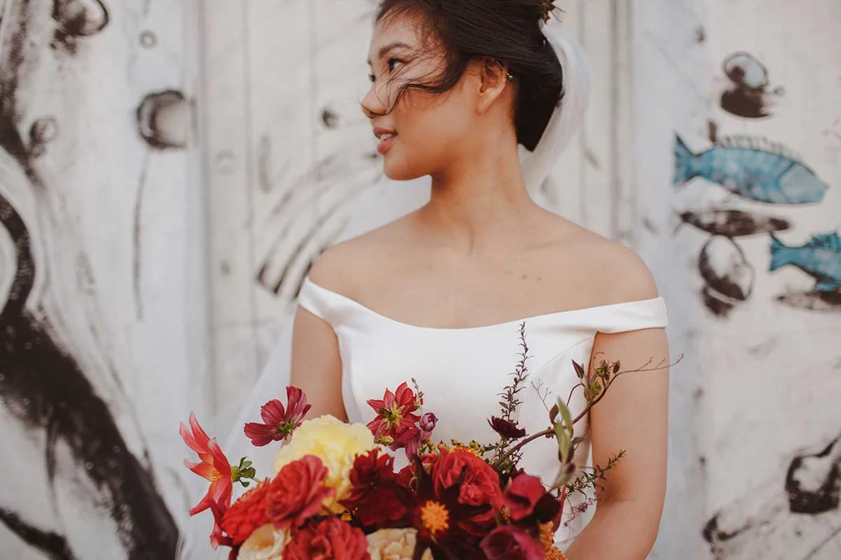 unique London wedding with red and gold summer flowers