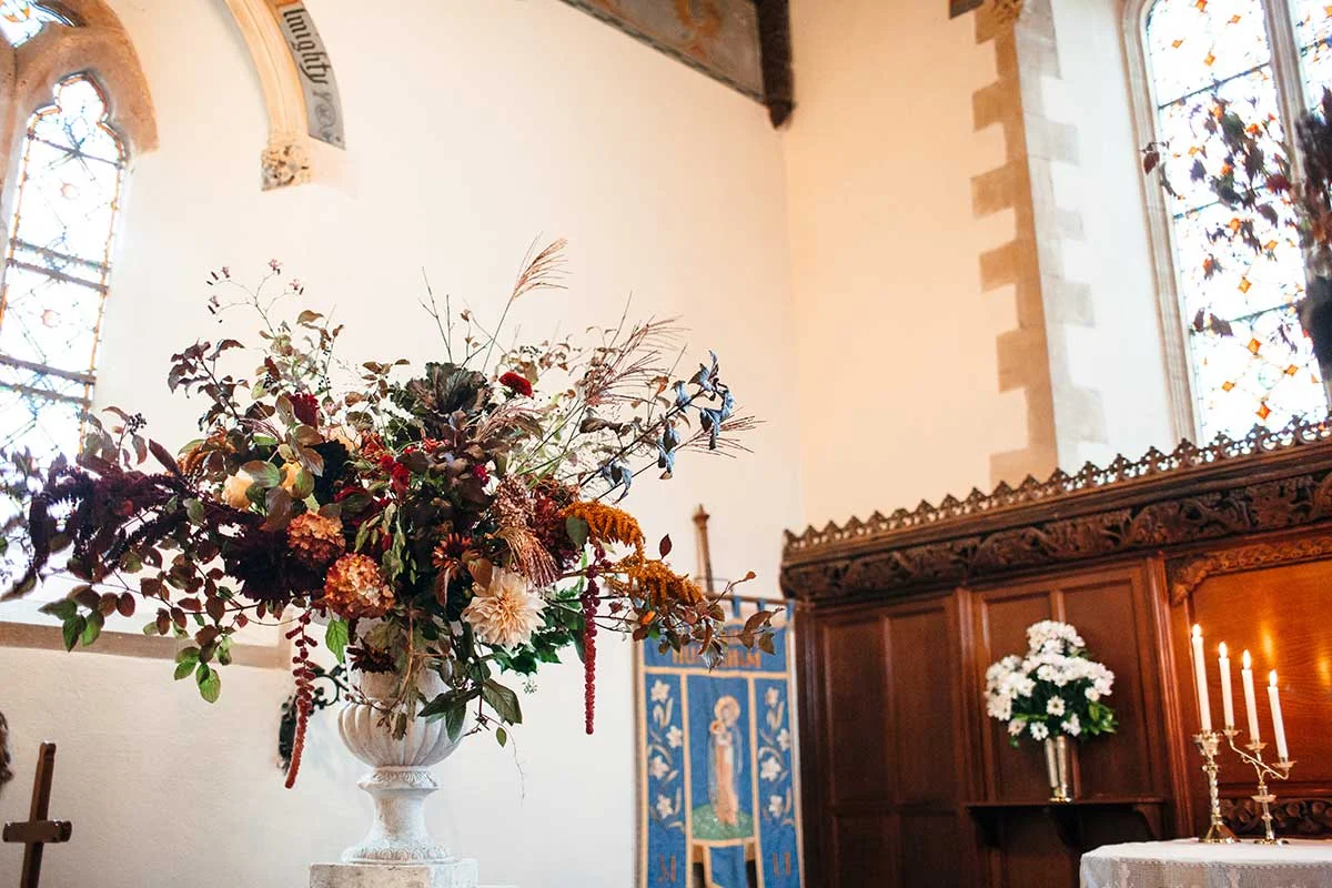 large urn arrangement with autumnal flowers