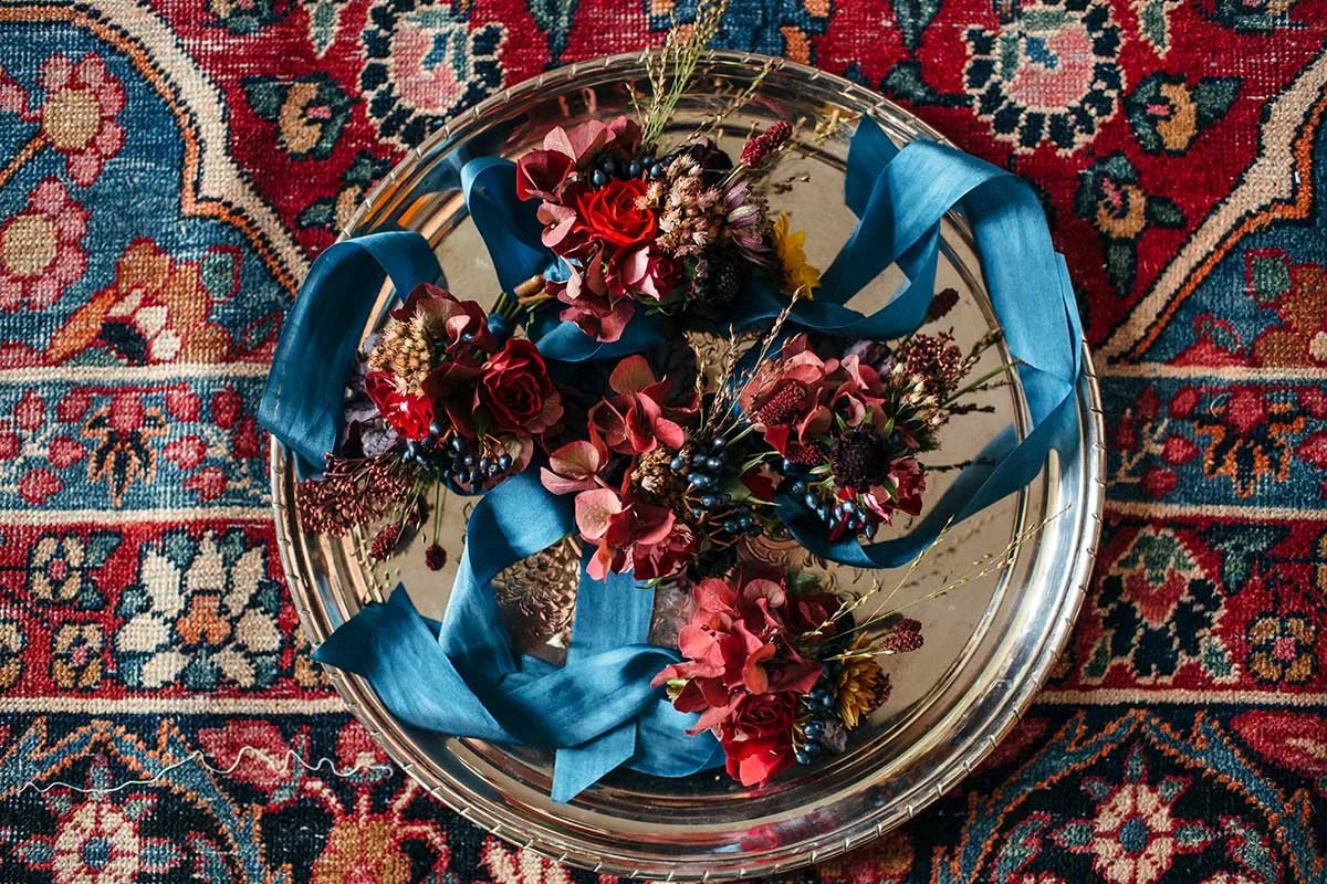 Vervain Unique Devon Wedding in Dark and Moody colours with autumnal blooms and silk ribbon