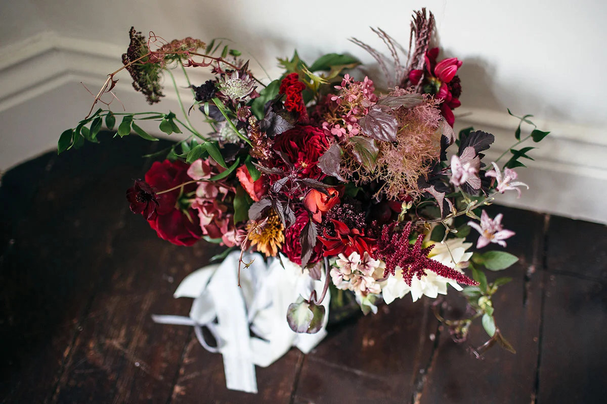 Vervain Unique Devon Wedding in Dark and Moody colours with autumnal blooms and silk ribbon