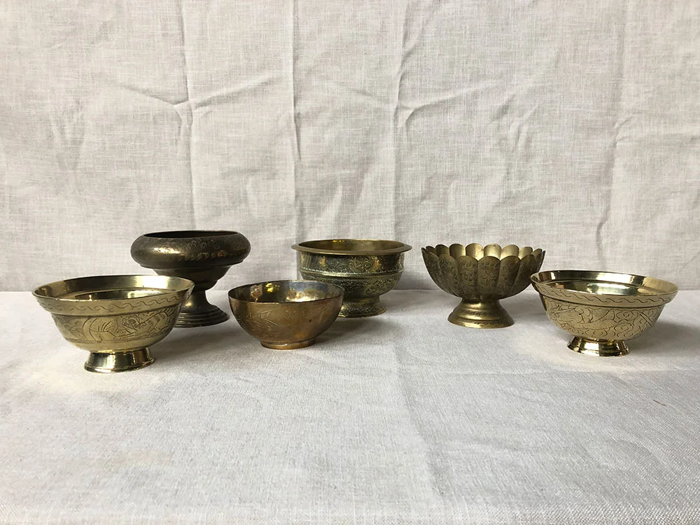 Selection of medium antique brass footed bowls
