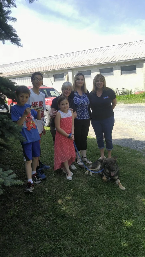 Audry, her family, and her Battle Buddy, Lily.