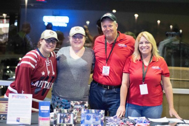 From left to right: Mallory Weimer, Grace Weimer, David Stouffer and Maria Stouffer. Hanging at the booth during the Hershey Bears Hometown Heroes Night. Photo courtsey of Capitals Outsider Blog .