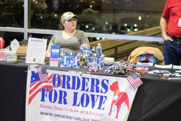 Grace Weimer helping a guest looking at our awesome shirts we had for sale. Photo courtsey of Capitals Outsider Blog .