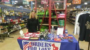 Founder and Executive Director, Maria Stouffer, hanging out at the booth at the Lancaster That Fish Place, That Pet Place promoting our cause and handing out candy to Trick or Treaters.