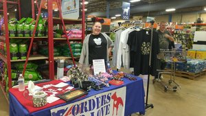 Event Coordinator and resident bow tie maker, Grace Weimer, hanging out at the booth at the Lancaster That Fish Place, That Pet Place.