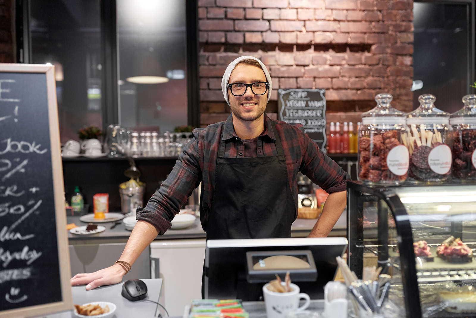 small business, people and service concept - happy seller man or