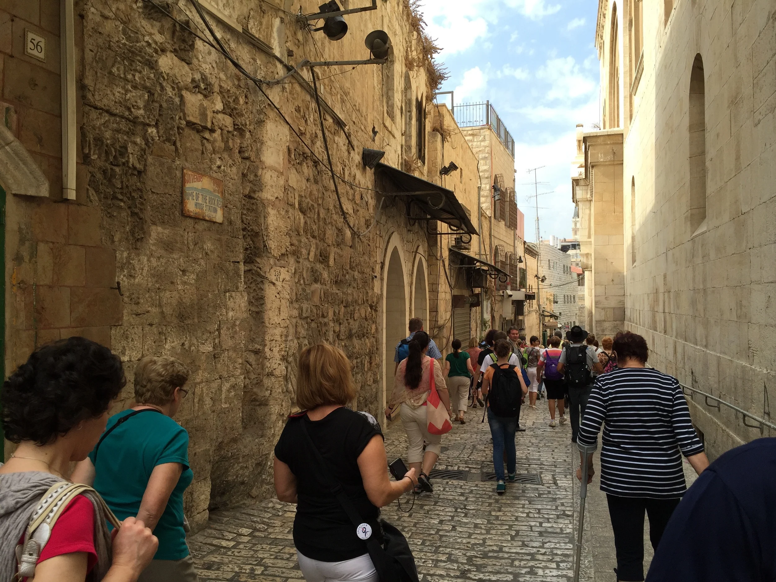 Barry and Gus took us from Bethesda to visit the Church of the Sepulcher. We took a moment to talk about a couple of possible routes Jesus may have taken to reach Golgotha, then they led us through the old city along the Via Dolorosa (Latin for "Way of Grief", "Way of Tears" or "Way of Suffering") to get there. The Via Dolorosa a the traditional Catholic route to the Church of the Sepulcher that involves the 14 stations of the cross; events that Catholic tradition belives happened to Jesus during his walk outside of town to be crucified. Along the way we encountered several tour groups heading the same way. 