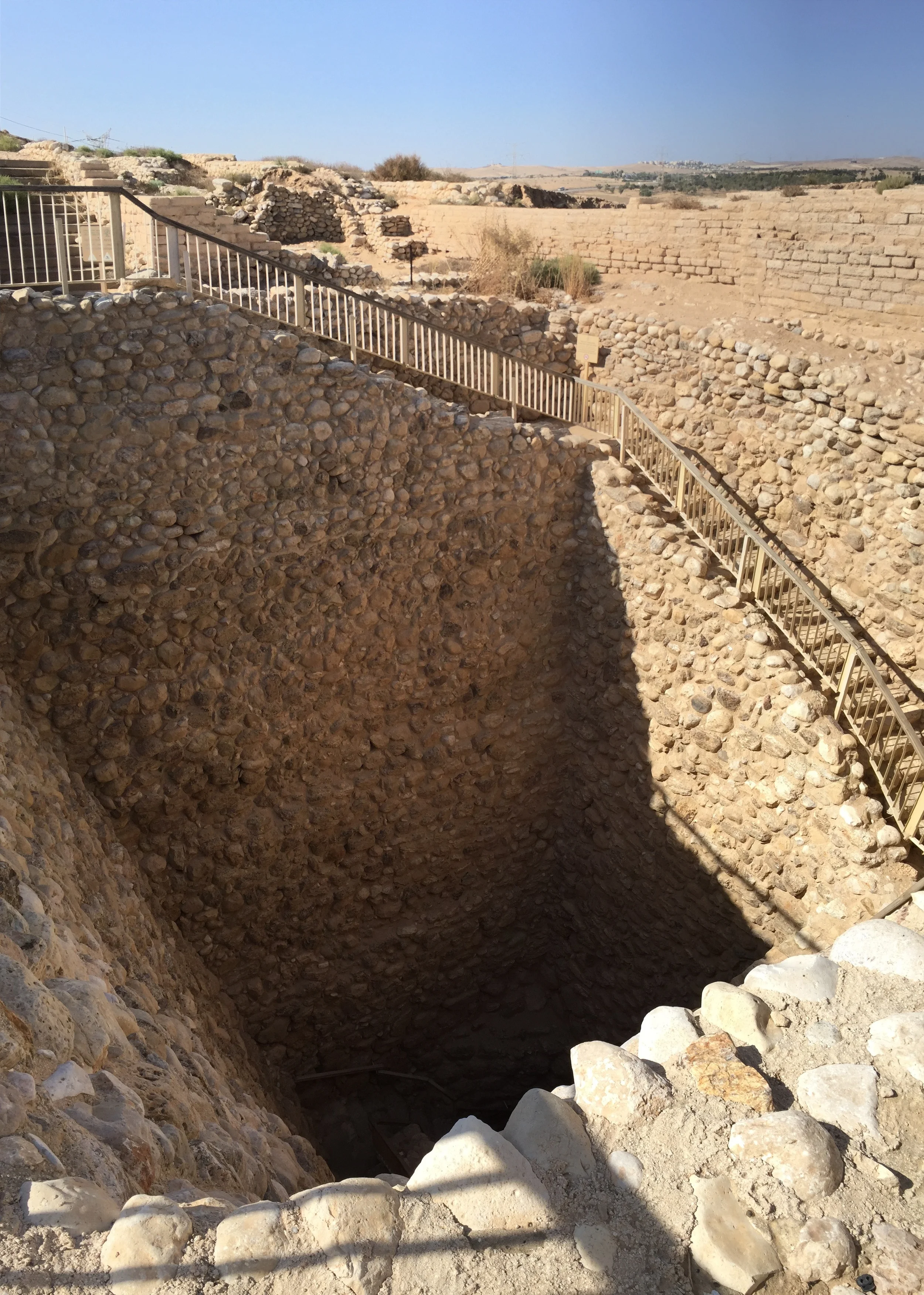 One of the fascinating features of the Be'er Sheva site is its water system. There is a 55 foot, stone lined shaft with stairs leading to an underground resevoir that could hold up to nearly 185,00 gallons of water! At the opposite end of the resevoir is a feeder channel that collected water from the Hebron streambed. Several of us put on construction hats, and walked down the stairs, through the resevoir and out the feeder channel.